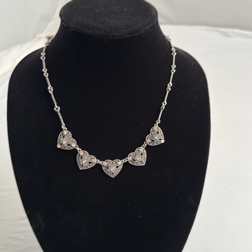 Silver tone and clear stone adjoining hearts necklace